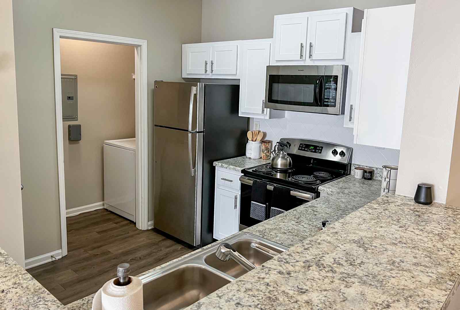 laundry room by kitchen