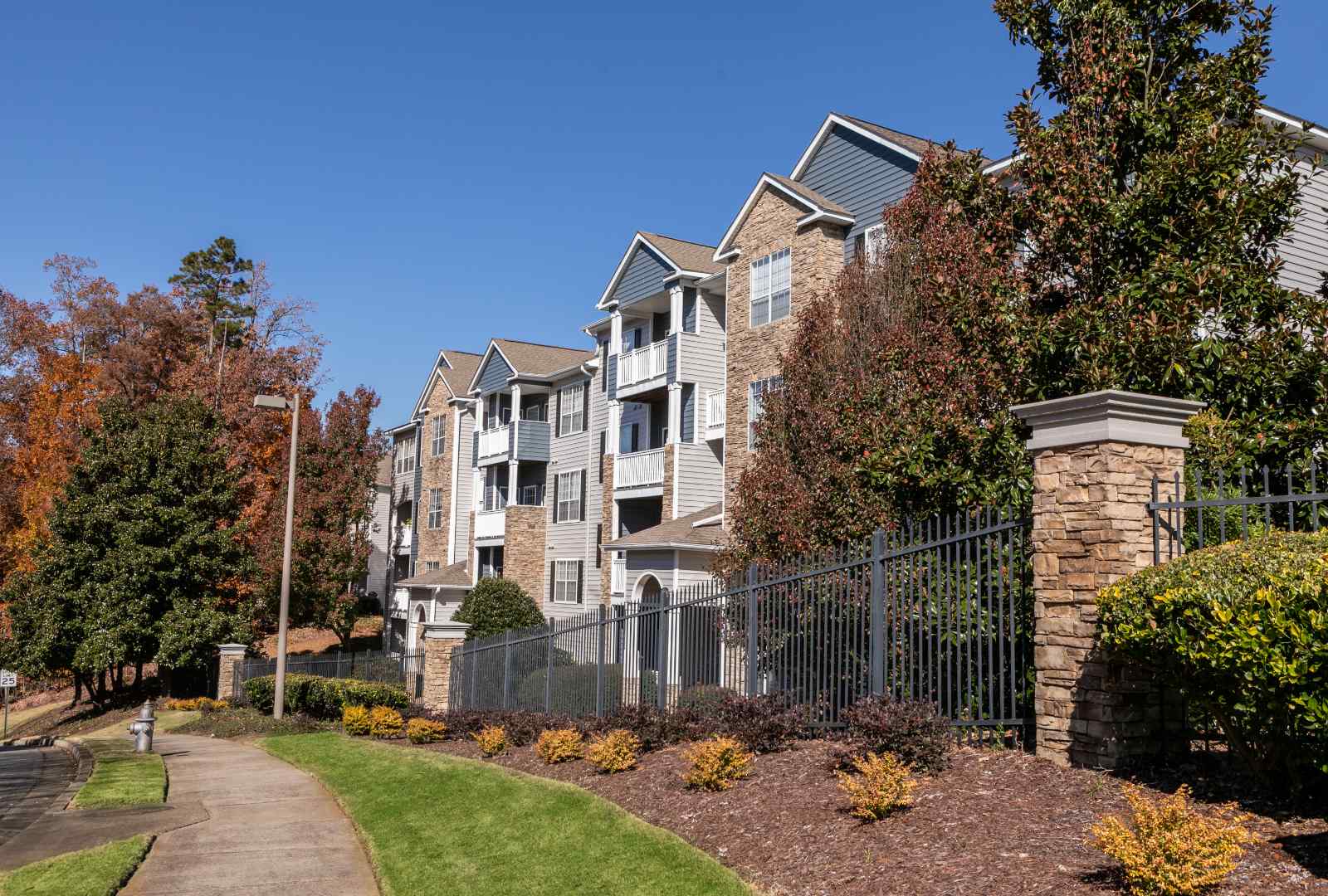 walkway alongside Halston Shiloh Valley apartment homes buildings